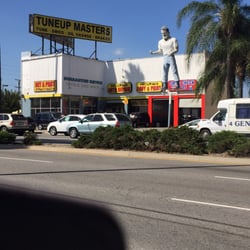 A store with a statue of a man on top of it