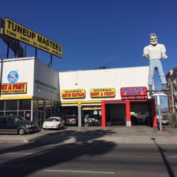 A store with a statue of a man on top of it